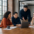 A diverse employer team discussing UK business immigration and sponsorship planning.